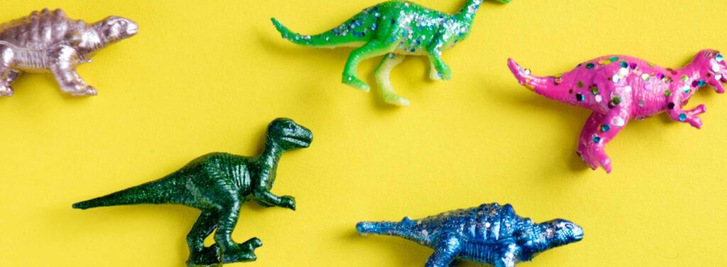 image of dinosaurs toys on yellow background