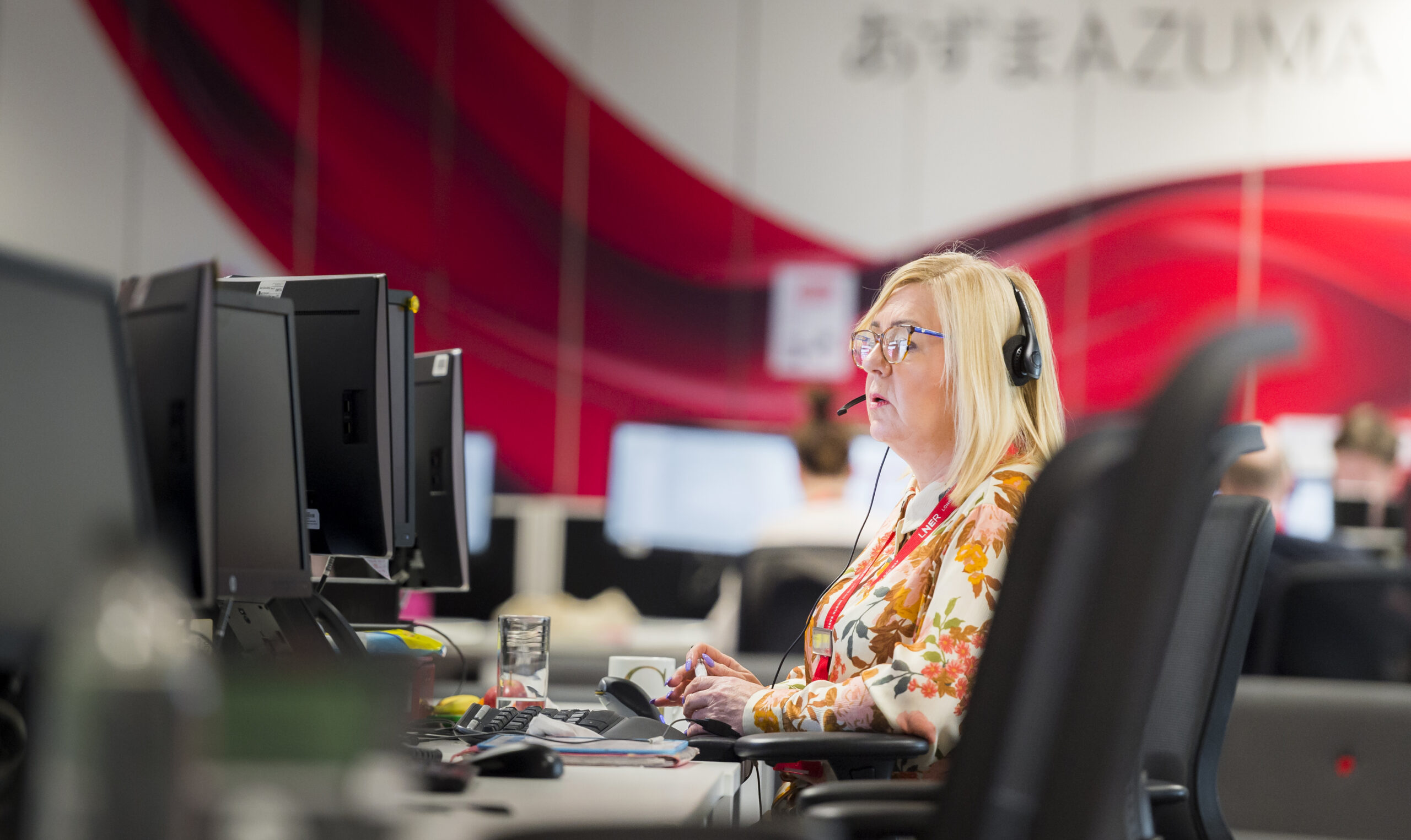 LNER Contact centre customer manager working on a computer