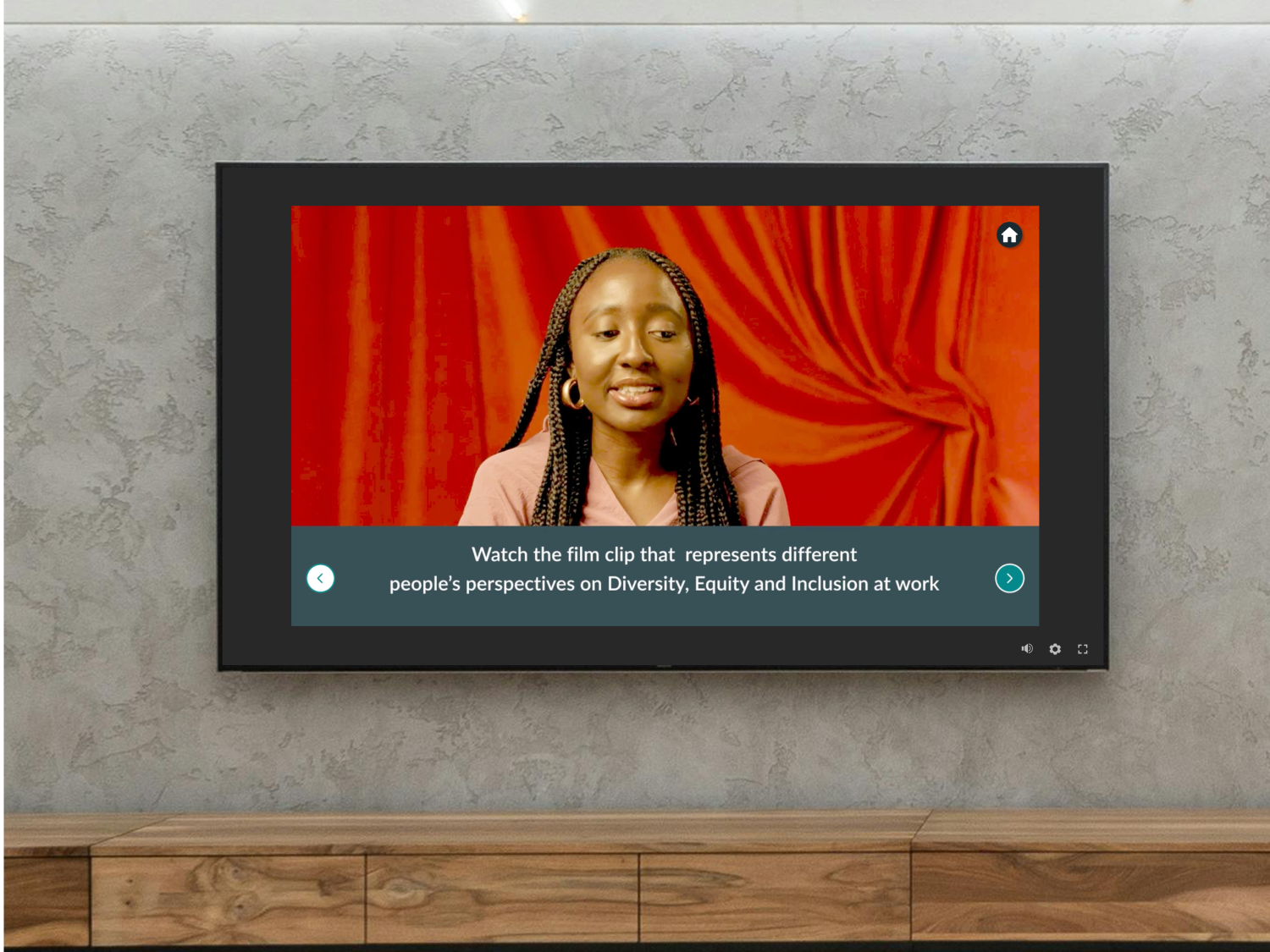 A television screen showing a woman in a video in Diversity, Equity and Inclusion at work
